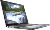 Dell laptop with silver body, open screen displaying a waterfall and forest scene