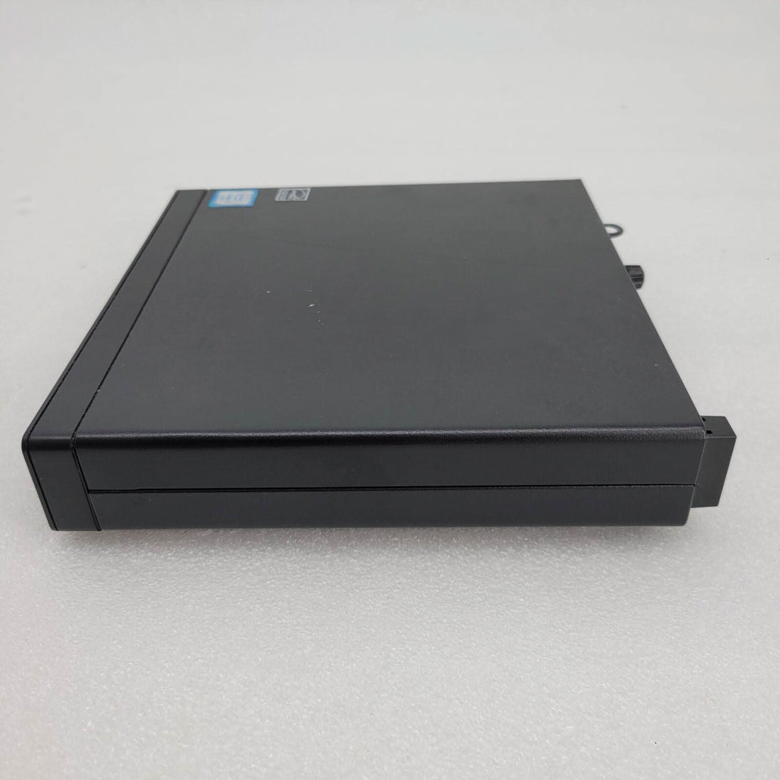 Refurbished black external DVD drive on white background