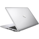 Silver HP laptop partially open with visible ports and keyboard on white background