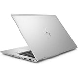 Silver HP laptop partially open, seen from rear angle, showing ports and keyboard