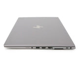 Closed silver HP laptop showing side ports including USB, HDMI, Ethernet, and USB-C