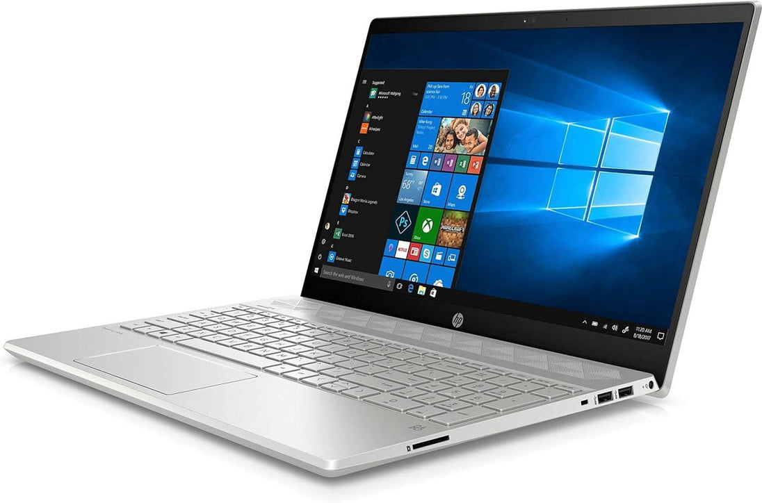 Silver HP laptop with Windows 10 open, showing modern keyboard and sleek design.