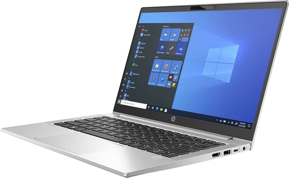 Silver HP laptop with Windows 10 home screen, sleek design, angled left side view