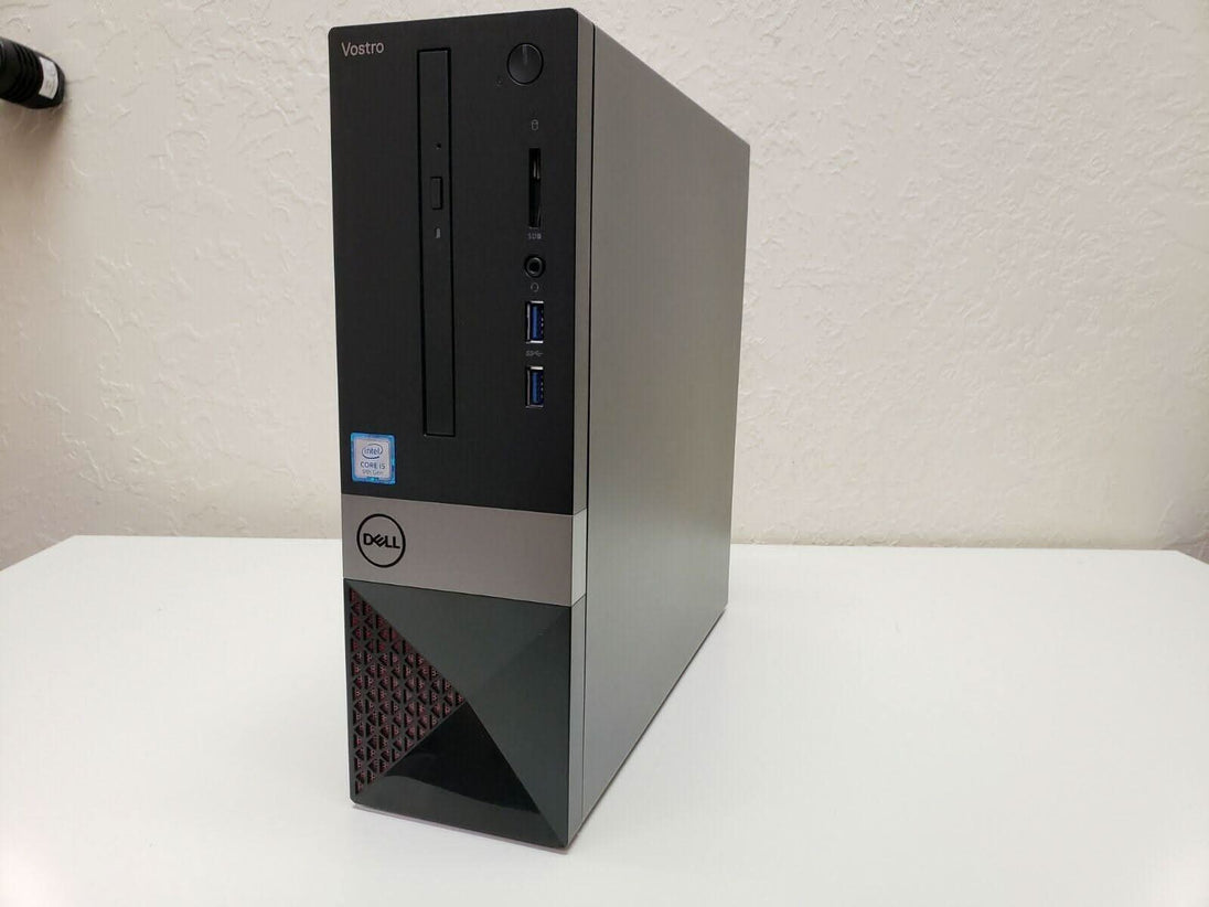 Dell Vostro desktop computer tower with USB ports and Intel Core i5 label on white desk