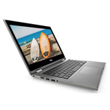Dell silver laptop with open screen displaying surfboards by the beach