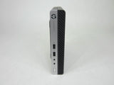 HP ProDesk mini desktop computer with front USB ports on a plain background