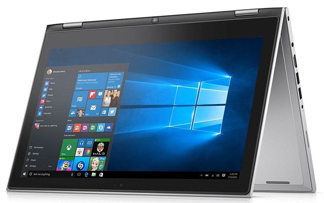 Convertible 2-in-1 laptop in tent mode with Windows 10 screen, silver body, multiple ports visible