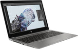HP ZBook silver laptop with open screen displaying graphic design software