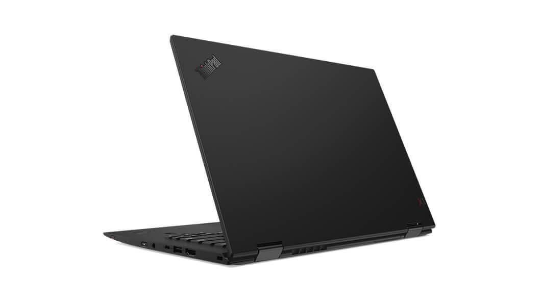 Black Lenovo ThinkPad X1 Carbon laptop angled open showing ports and branding