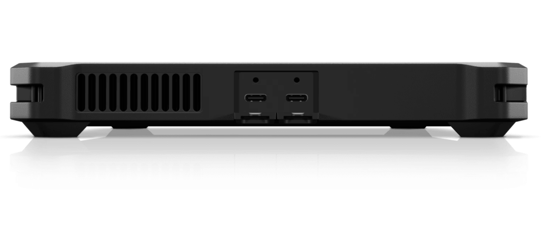 Close-up of a black electronic device showing rear ports and cooling vent, suitable for refurbished tech.