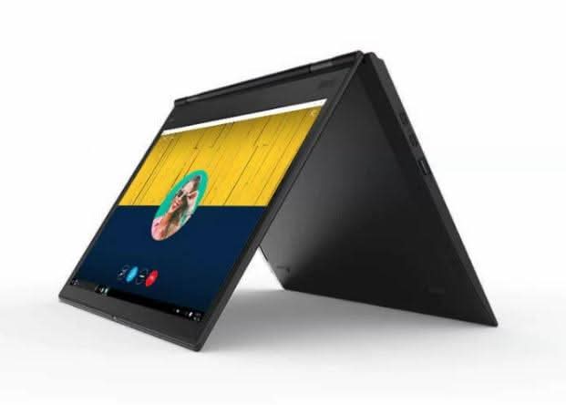 Convertible laptop in tent mode displaying a video call screen, black body, modern design