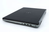 Closed black Dell laptop with side ports on a white background, refurbished notebook