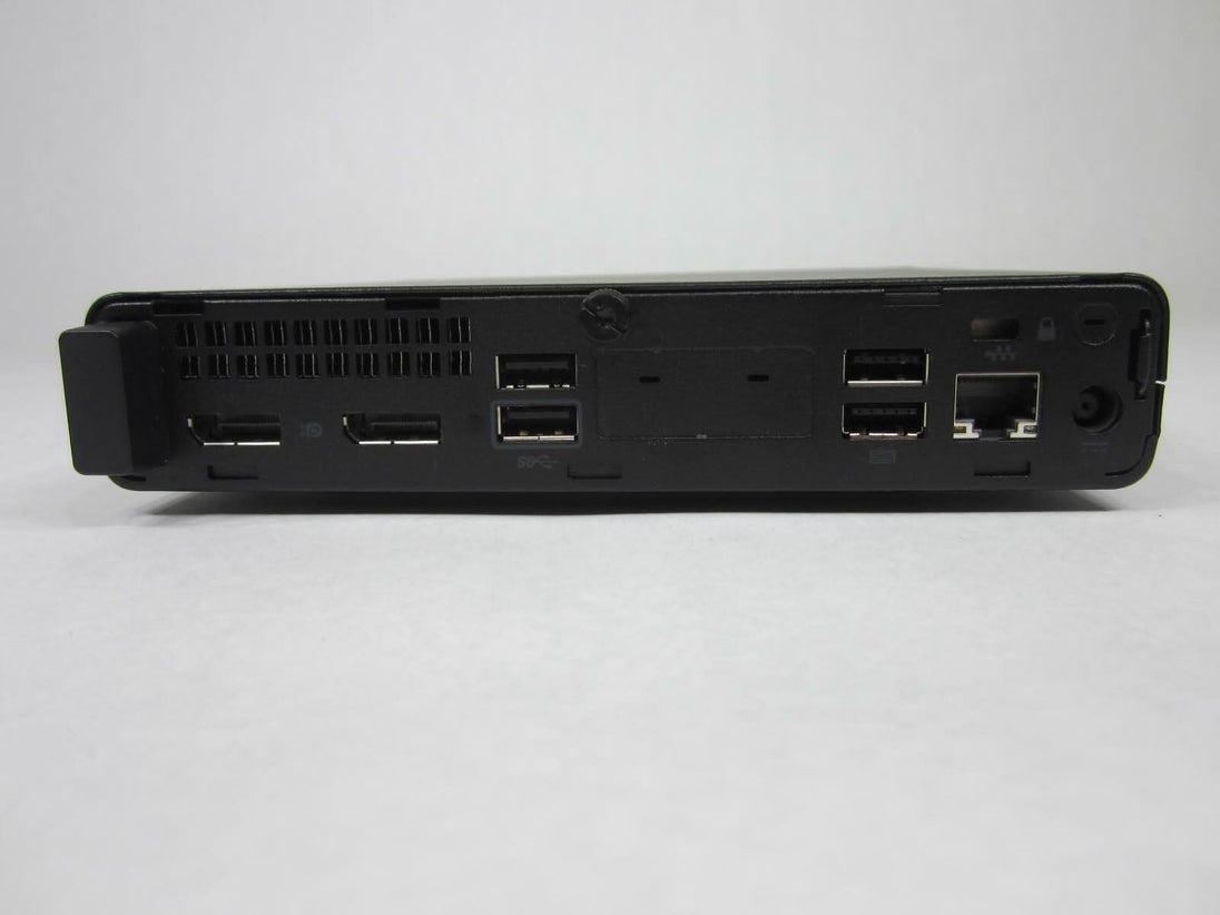 Rear view of a refurbished docking station with multiple USB, HDMI, Ethernet ports on white background